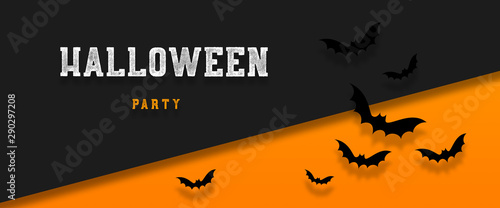 Halloween holiday background with bats flying over orange background. Halloween concept. Flat lay