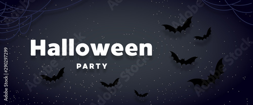 Halloween holiday background with bats flying over orange background. Halloween concept. Flat lay