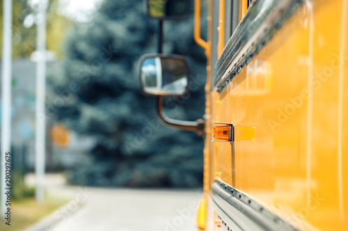School bus side close-up blurred