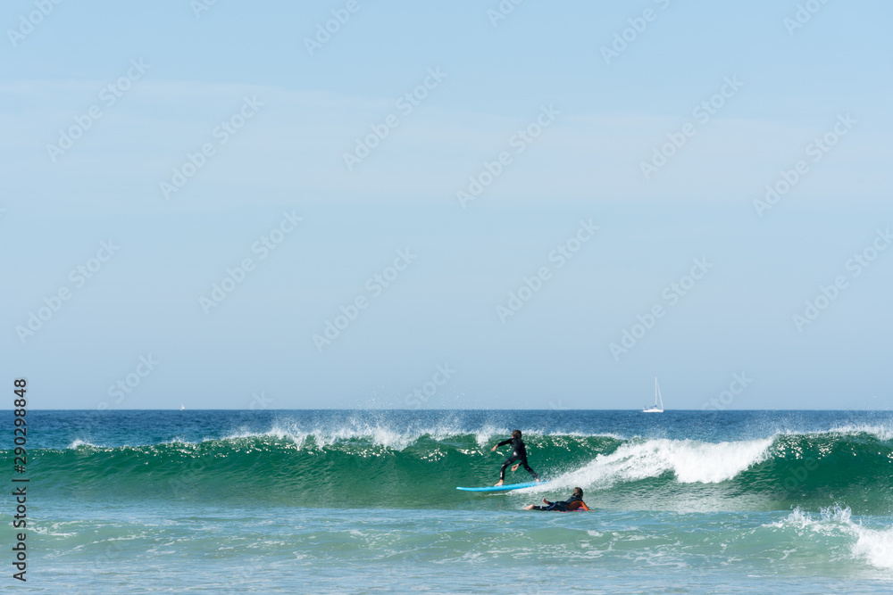 young boy surfing on the west coast of Brittany in France at Toulinguet Beach near Camaret-Sur-Mer