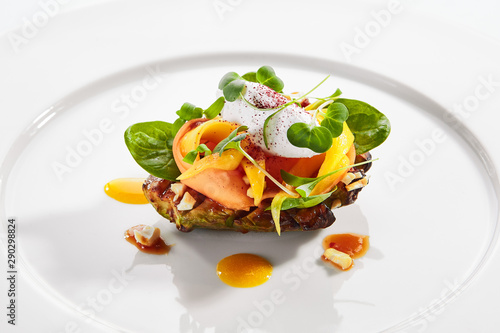 Slika na platnu Exquisite serving avocado with mozzarella cream and dried tomato jam