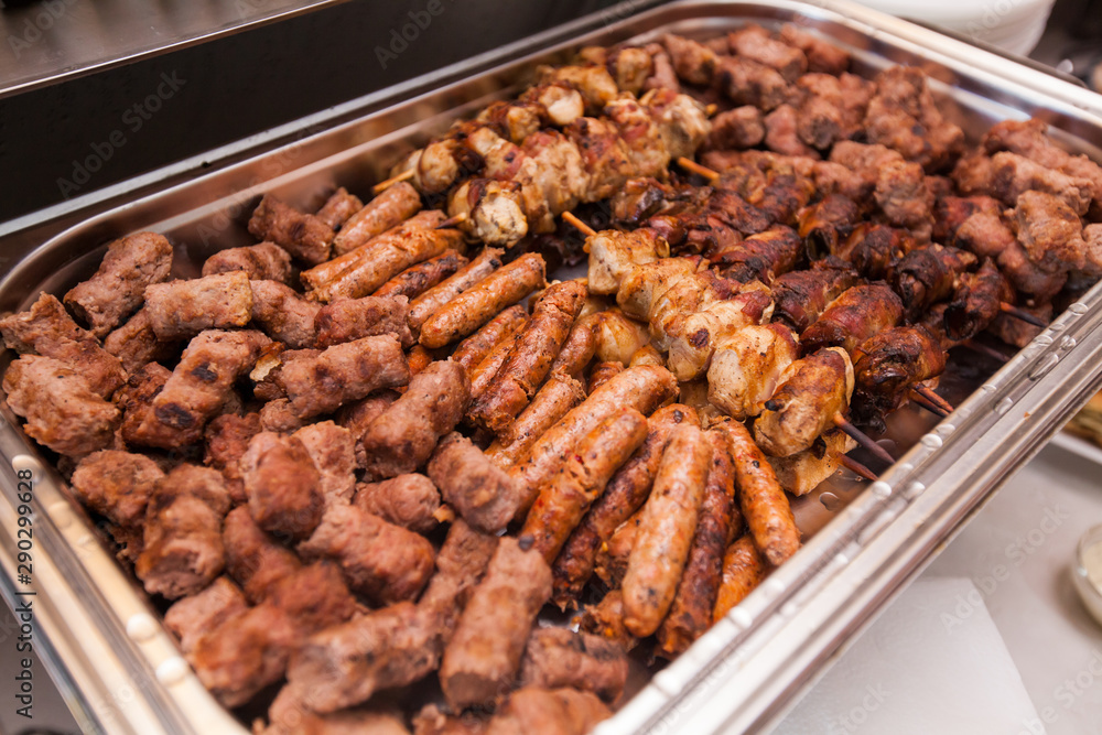 Tasty grilled mix meat, serving on event dish at party Tasty grilled mix meat, serving on event dish at party