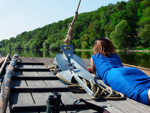 girl stern of a pleasure boat during a boat trip on the Loire River