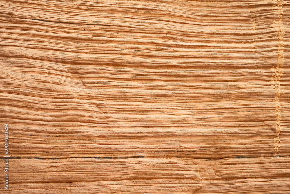 Naklejka premium Sandstone cliffs have parallel lines etched into them by weather erosion in Canada's Madeleine Islands.