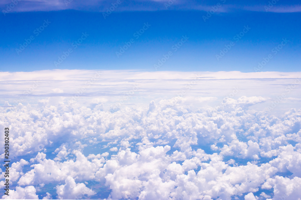 Fluffy white clouds on a blue sky background Fluffy white clouds on a blue sky background