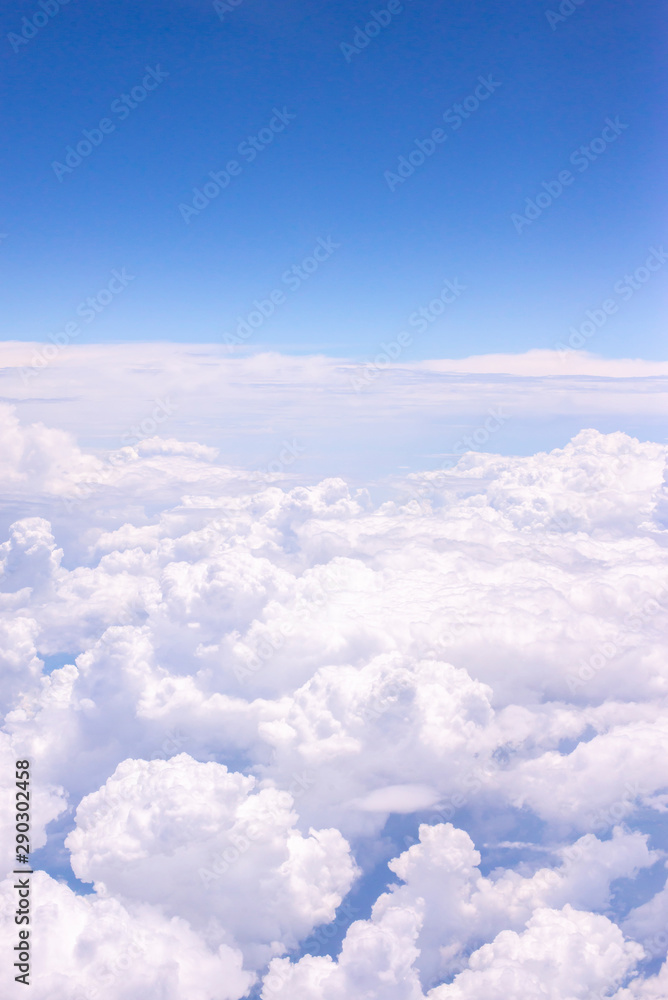 Fluffy white clouds on a blue sky background Fluffy white clouds on a blue sky background