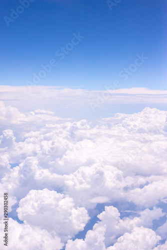 Fluffy white clouds on a blue sky background