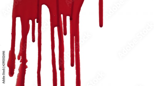 Streaks of blood pouring on a white surface photo