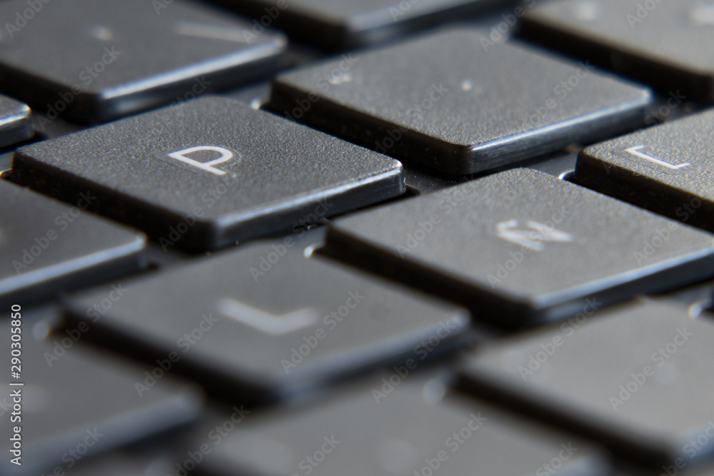 Black laptop keyboard. Image in escape of keys with a fixed point and out of focus. Black laptop keyboard. Image in escape of keys with a fixed point and out of focus.
