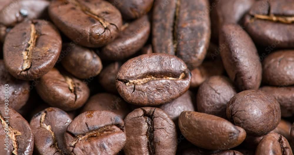 Close-up of coffee beans background. Camera movement zoom in shot. Close-up of coffee beans background. Camera movement zoom in shot.