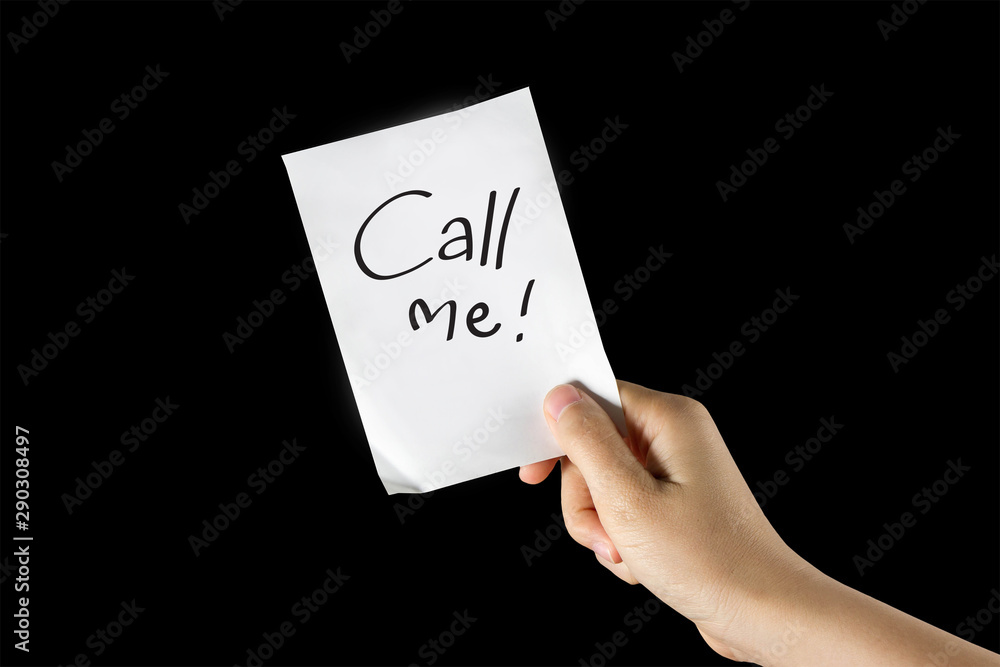 Hand holding Call me paper note Hand holding Call me paper note