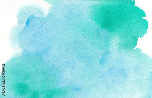 Blue green watercolor paint splash or blotch background with fringe bleed wash and bloom design, blobs of paint on watercolor paper texture grain photo