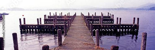 A panoramic picture of jetty boat moorings on a misty morning at Lake Windermere Lake Disrict, Cumbria, England. photo
