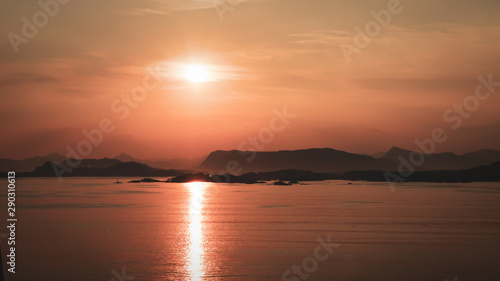 Sunrise Over Mountains At Sea © Robert