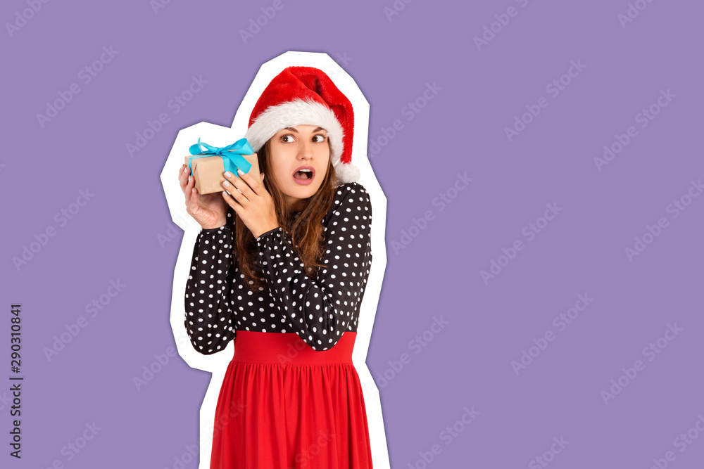 alarmed girl with her gift listens to what's in the box. Magazine collage style with trendy color background. holidays concept