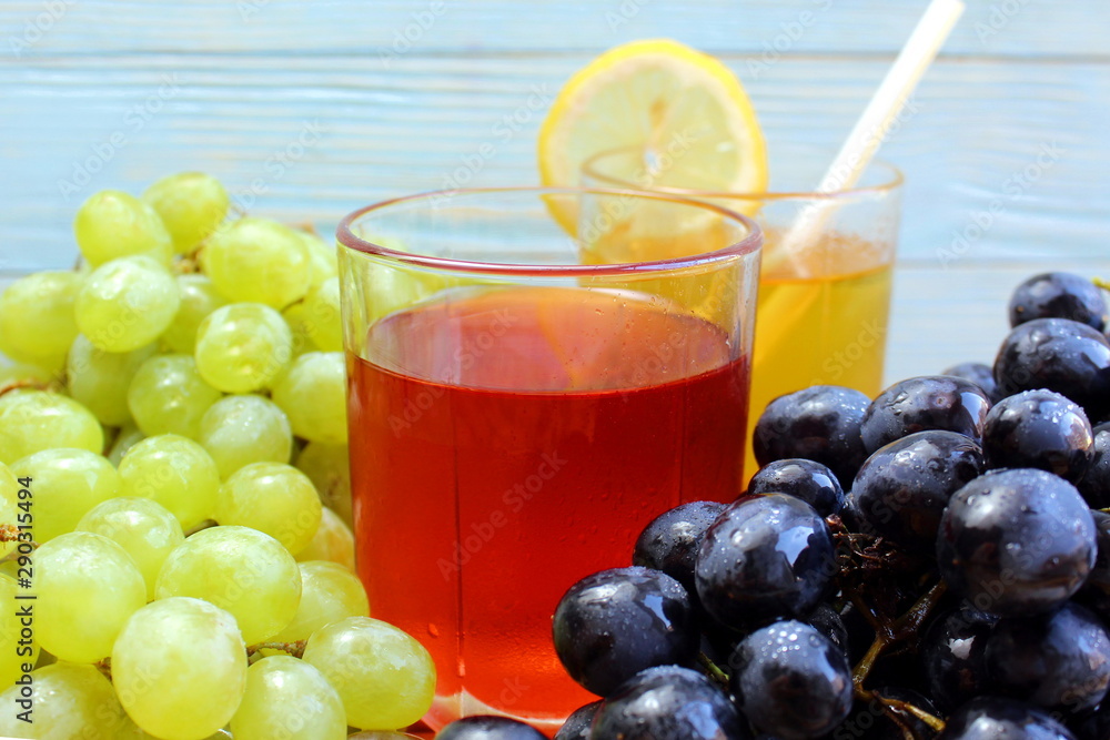 two glasses of fresh juice from different grape varieties two glasses of fresh juice from different grape varieties