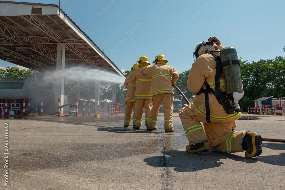 Firefighters training, foreground is drop of water springer, Selective focus.