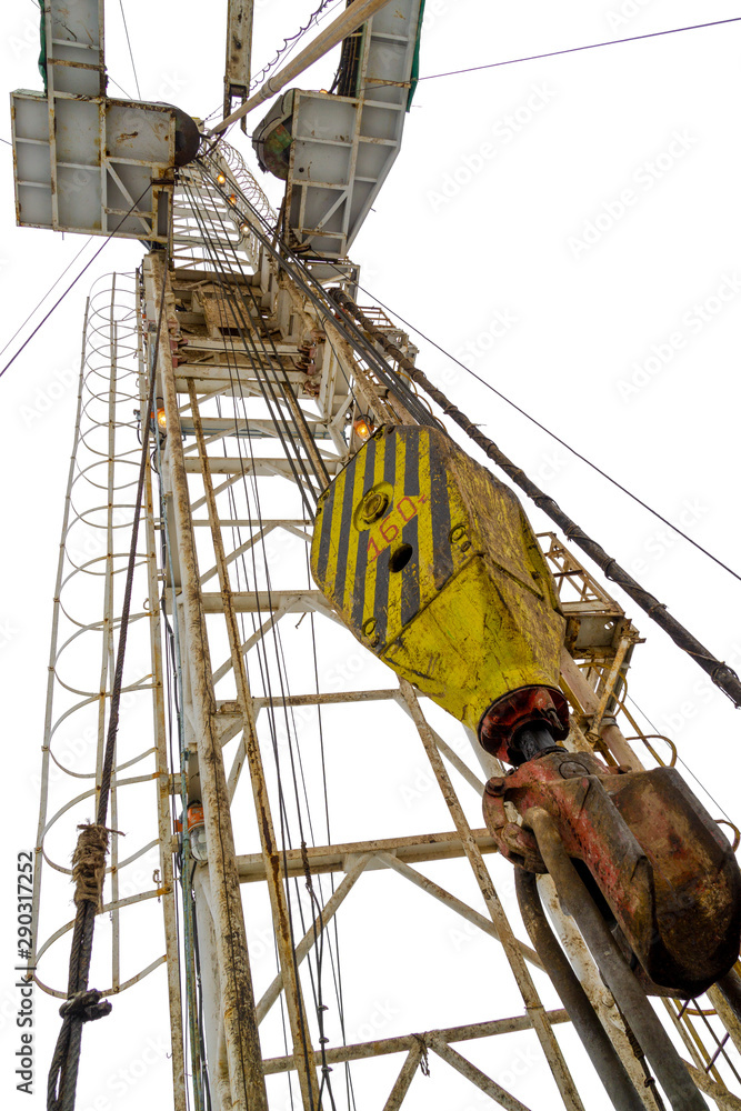 Oil and Gas Drilling Rig. Oil platform isolated on white background. Drilling rig in oil field for drilled into subsurface in order to produced crude, inside view. Petroleum Industry. Oil and Gas Drilling Rig. Oil platform isolated on white background. Drilling rig in oil field for drilled into subsurface in order to produced crude, inside view. Petroleum Industry.