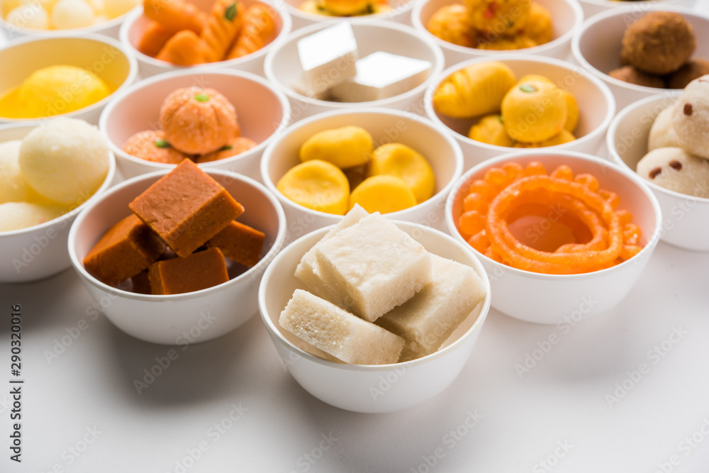 Rangoli of Assorted Indian sweets/mithai in bowl for Diwali or any other festivals, selective focus Rangoli of Assorted Indian sweets/mithai in bowl for Diwali or any other festivals, selective focus