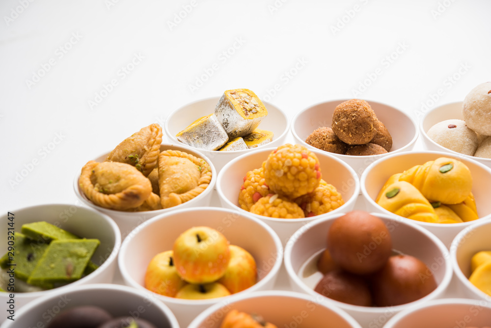 Rangoli of Assorted Indian sweets/mithai in bowl for Diwali or any other festivals, selective focus