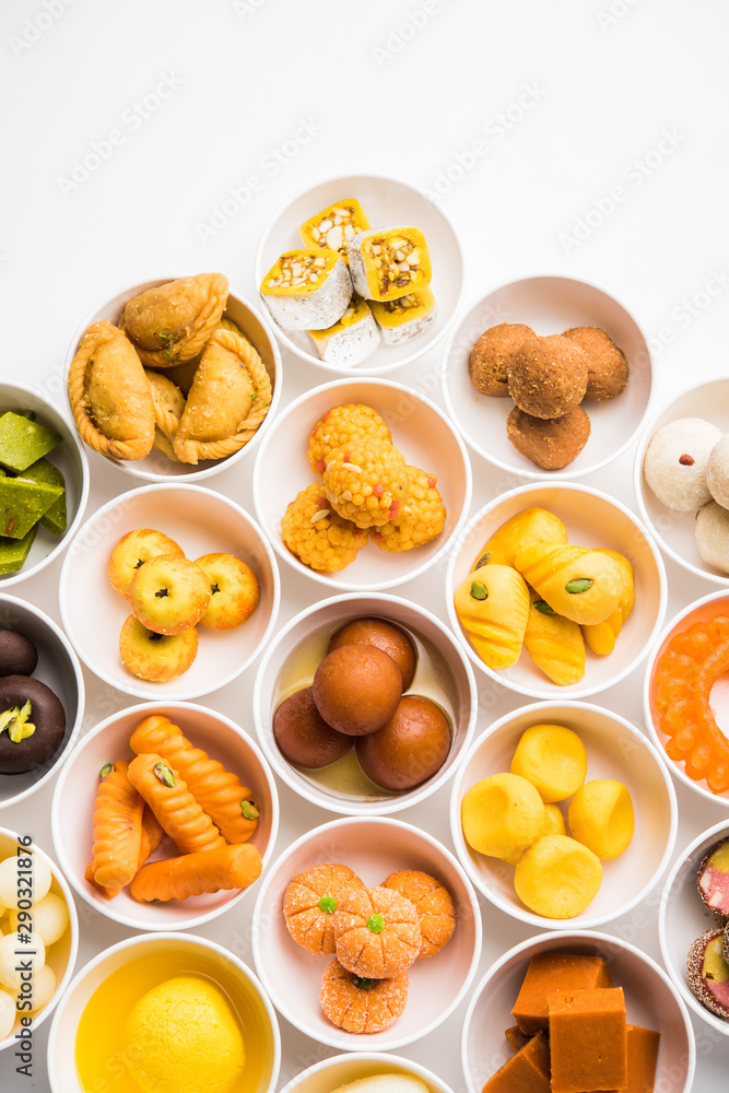 Rangoli of Assorted Indian sweets/mithai in bowl for Diwali or any other festivals, selective focus Rangoli of Assorted Indian sweets/mithai in bowl for Diwali or any other festivals, selective focus