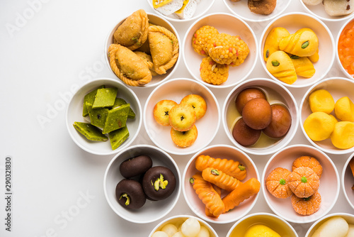 Rangoli of Assorted Indian sweets/mithai in bowl for Diwali or any other festivals, selective focus photo