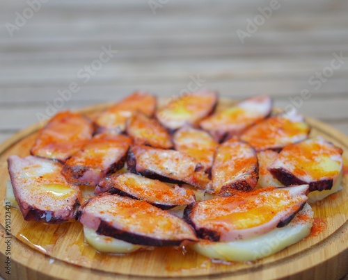 Sliced octopus grill with pimento paprika powder and potato