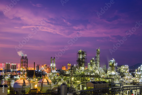 Oil and gas refinery plant or petrochemical industry on sky sunset background  Gas storage sphere tank and distillation tower in petroleum industrial