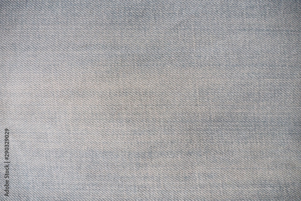 Fototapeta premium Closeup of black jeans fabric with texture and rough surface in black and white or gray vintage tone for background and decoration. Textile texture grunge wallpaper and cool banner in page and cover