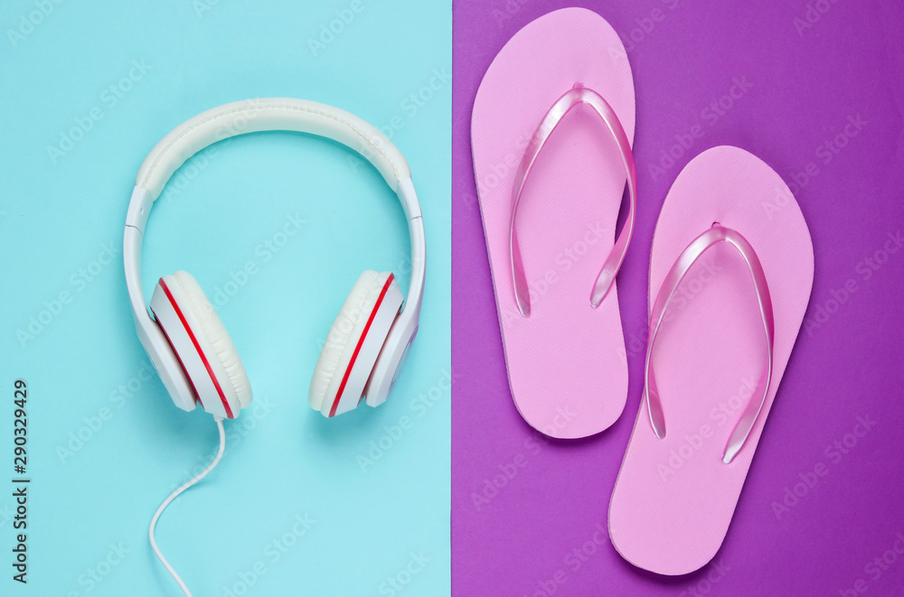 Flip flop and headphones on colored background. Summertime relax. Summer vacation. Beauty and fashion. Top view. Flat lay Flip flop and headphones on colored background. Summertime relax. Summer vacation. Beauty and fashion. Top view. Flat lay