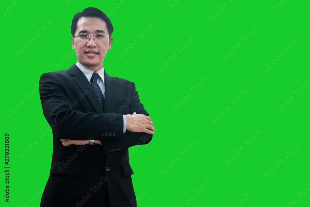 Successful Asian businessman standing and arms crossed confidential, business man smiling on green screen studio. Successful Asian businessman standing and arms crossed confidential, business man smiling on green screen studio.