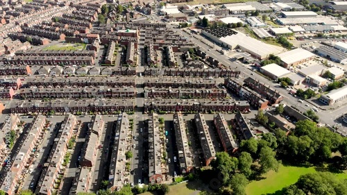 Aerial footage of the town known as Beeston in Leeds West Yorkshire UK, showing a rows of houses in a typical British housing estate taken with a drone on a bright sunny. photo