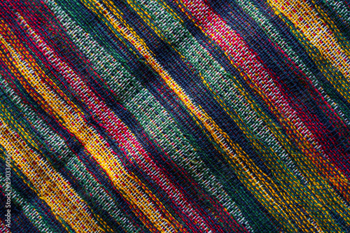 Texture of motley striped fabric closeup. Tapestry background
