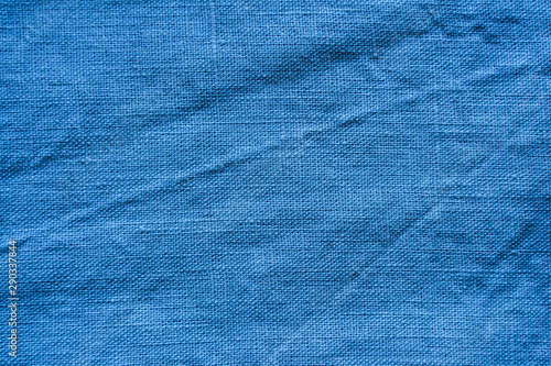 Blue linen cloth texture. Natural fabric material background