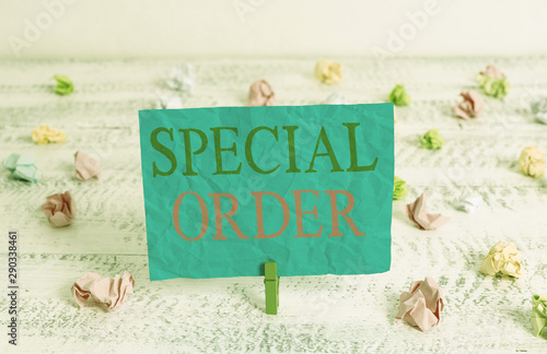 Word writing text Special Order. Business photo showcasing Specific Item Requested a Routine Memo by Military Headquarters Green clothespin white wood background colored paper reminder office supply photo