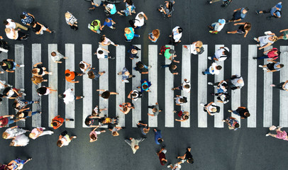 Aerial. Pedestrians on pedestrian crosswalk. Top view.