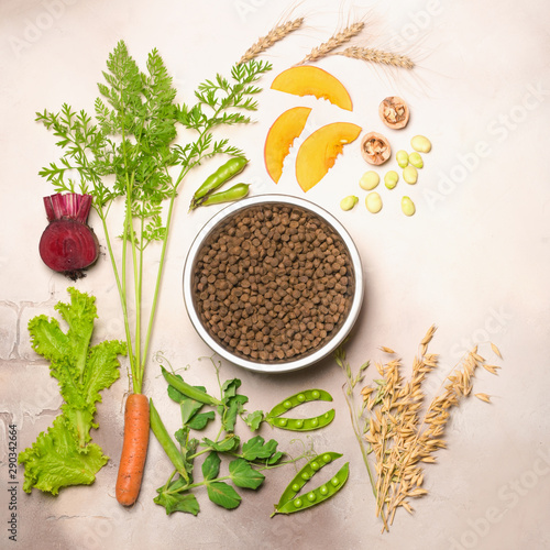Special vegan pet food and natural raw ingredients on light grey background. Flat lay.