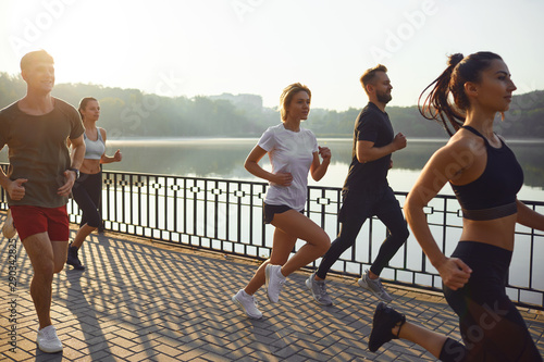 Group of runners in the park in the morning. photo