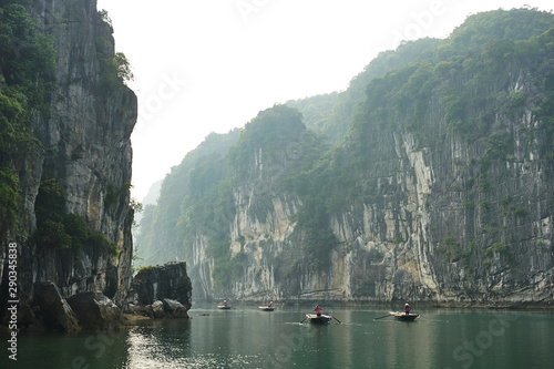 A tourists boats in the karst landscape of Ha Long Bay, Quang Ninh Province, Vietnam. Ha Long Bay is a UNESCO World Heritage Site.