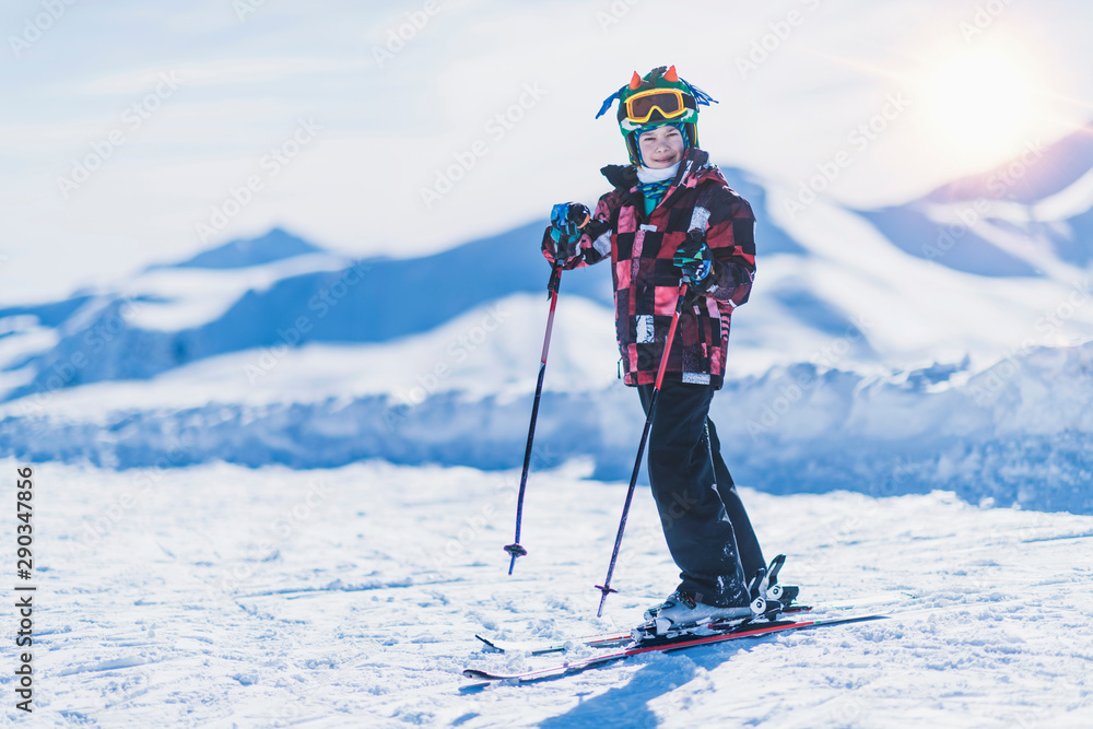 Young Skier on Top of Ski Resort - obrazy, fototapety, plakaty 