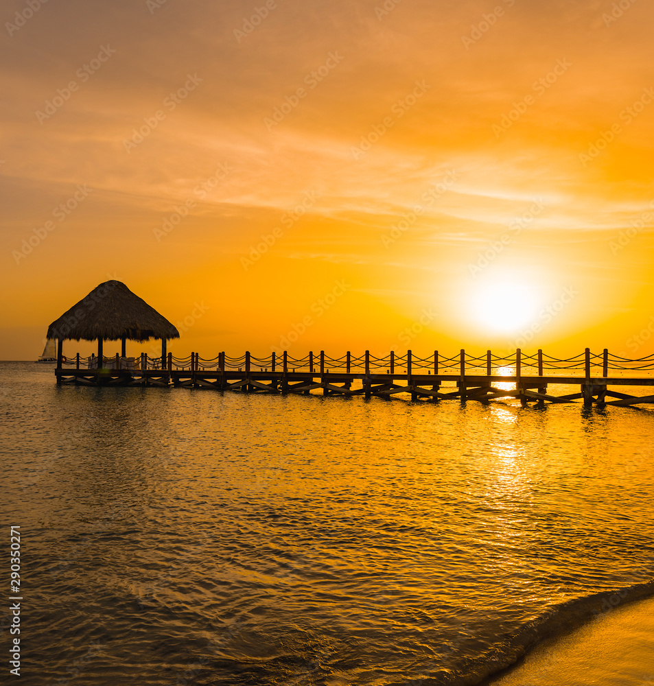 beautiful orange sunset on the sea with a pier beautiful orange sunset on the sea with a pier