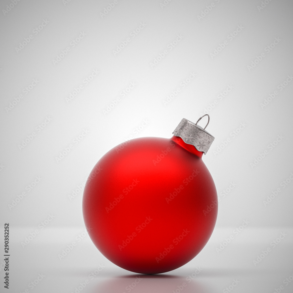 Matte red Christmas ball on light grey Matte red Christmas ball on light grey