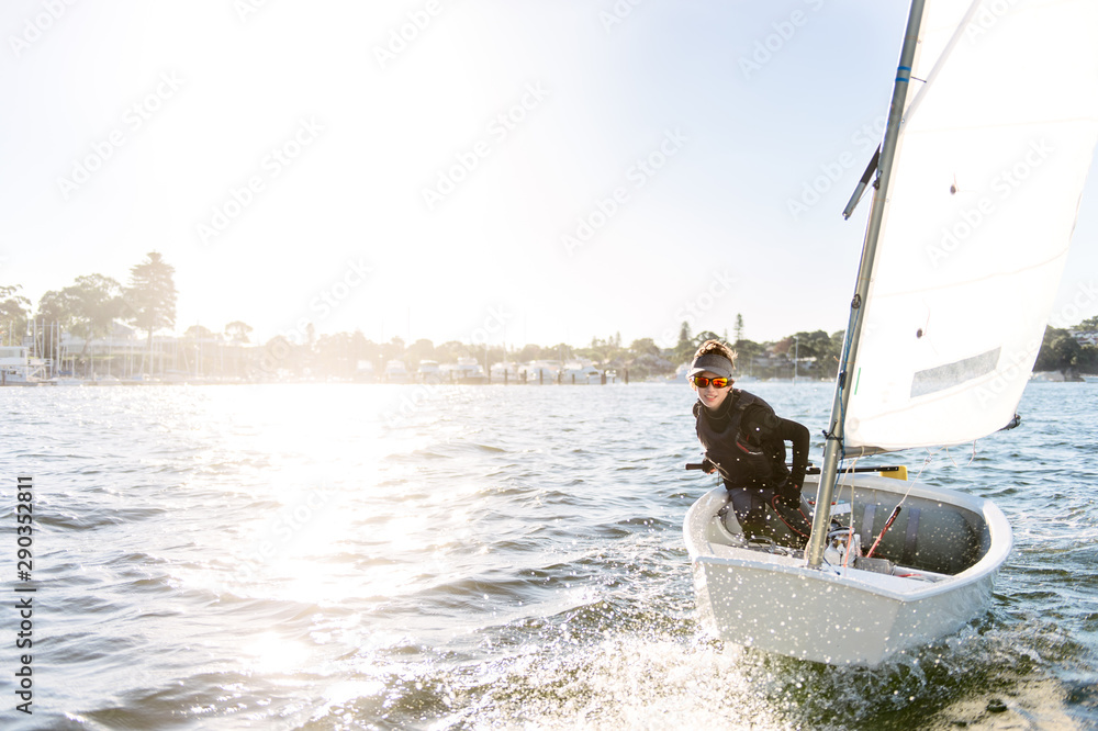 Teenage boy sailing an optimist dinghy Stock Photo