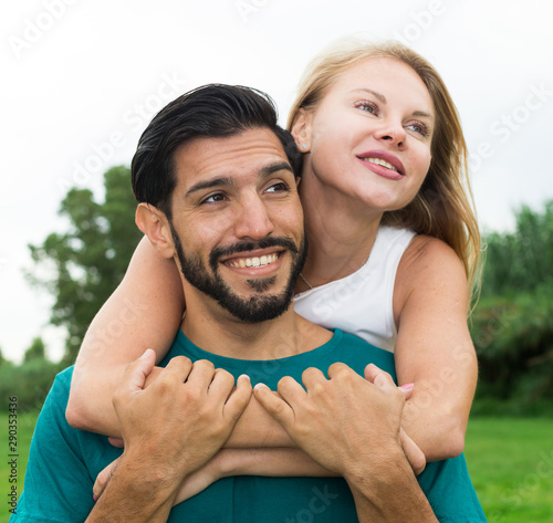 Portrait of man with girlfriend who are viewing nature together photo