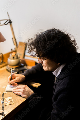 Man making handmade rubber stamp photo