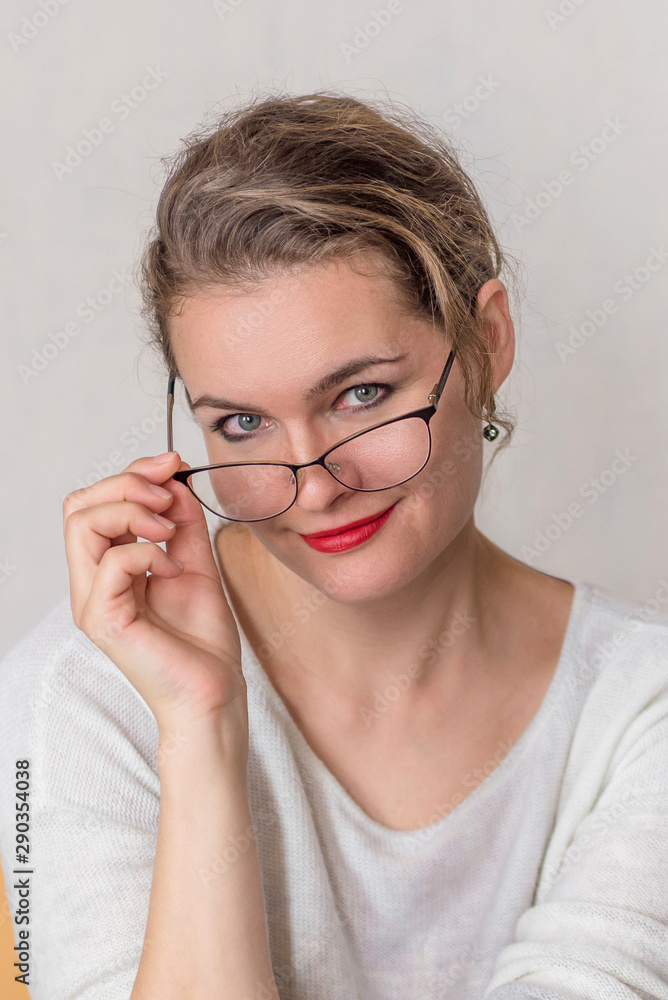 portrait of an attractive adult woman with glasses on a white background copy space portrait of an attractive adult woman with glasses on a white background copy space