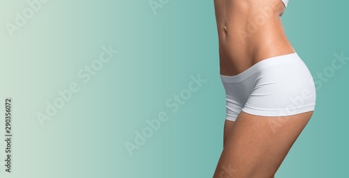 Young woman showing waist. weight loss concept © BillionPhotos.com