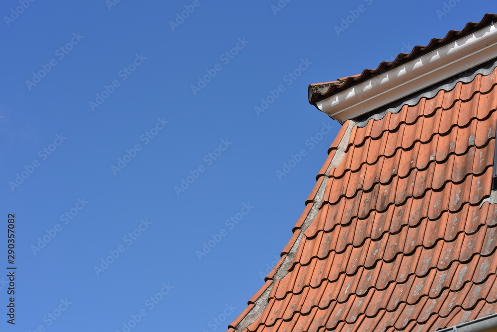 old tile roof against the sky