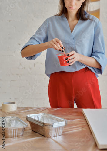 Female artist diluting paint