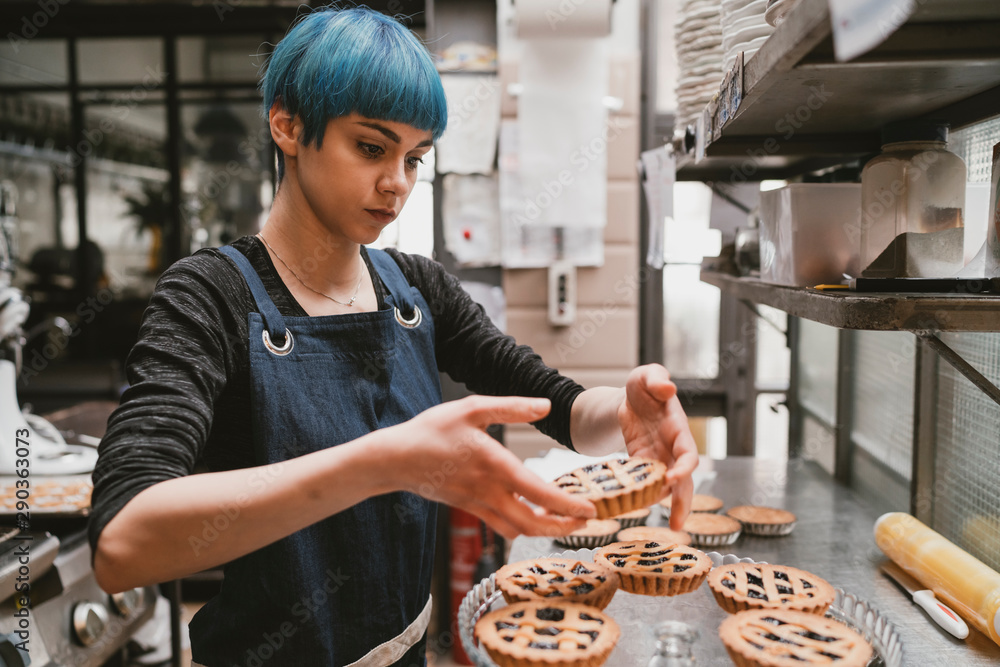 © Wells/Stocksy - pastry chef baking tarts